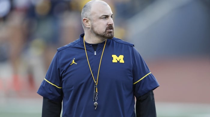 Michigan assistant Chris Partridge looks on during a practice.
